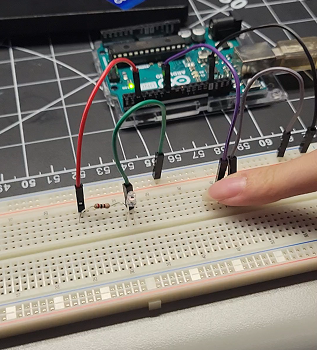 Then, we had used a button to control the LED light, so the light would only turn on when the button was pressed.