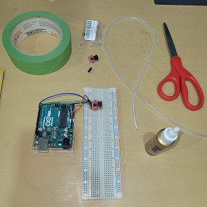 I had assembled all of my materials for this activity, (the Arduino, wires, breadboard, a digital barometric pressure sensor, tubes, scissors, glue, and some tape)